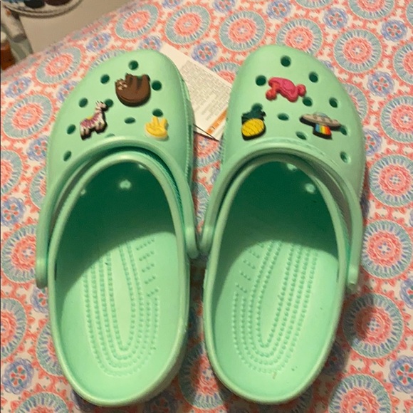 mint green crocs with fur